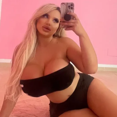 Curvy plastic blonde selfie