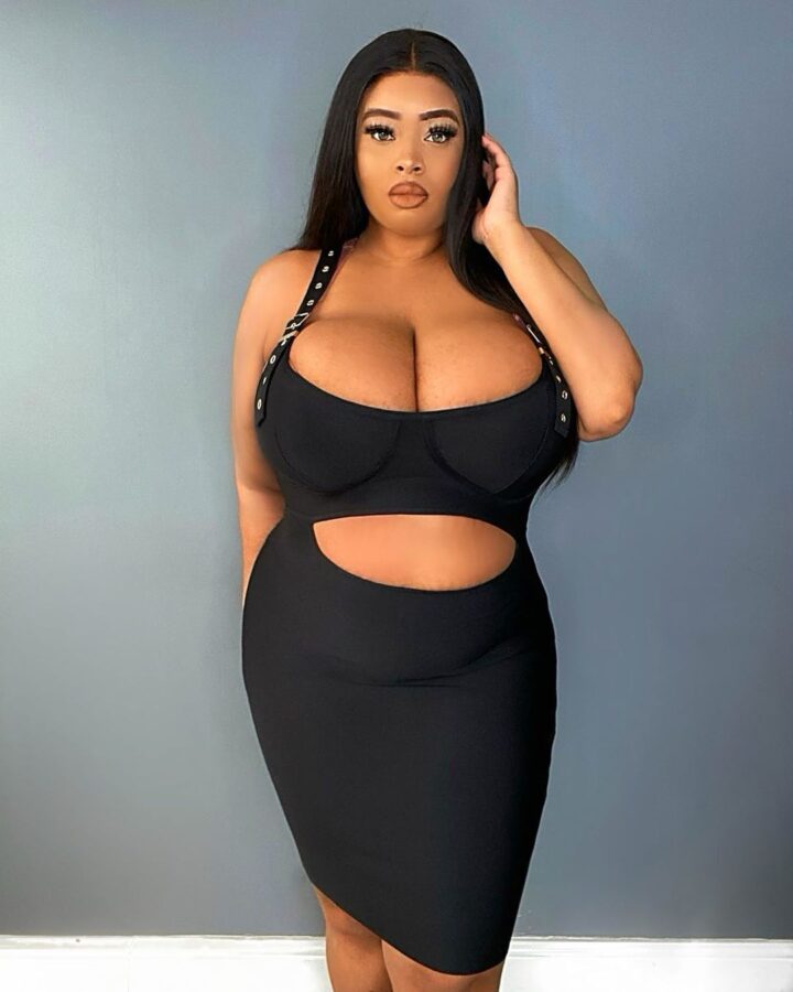 Busty ebony in tight black dress