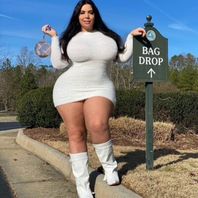 Hot busty babe in tight white dress