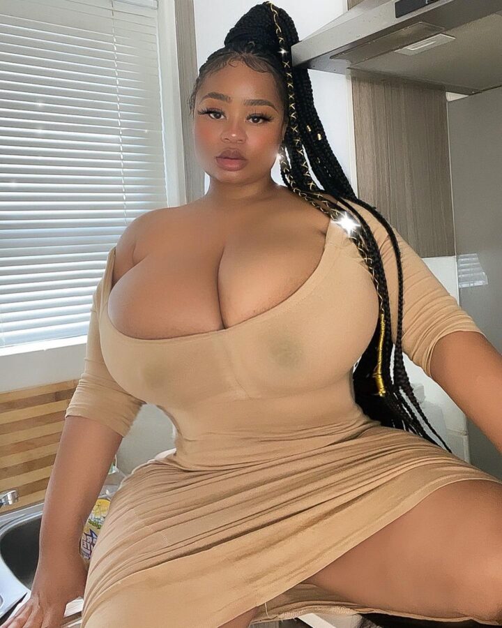 Busty ebony with massive boobs in tight dress