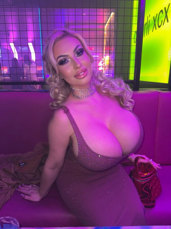 Elite escort blonde sex bomb with perfect fake breasts night out