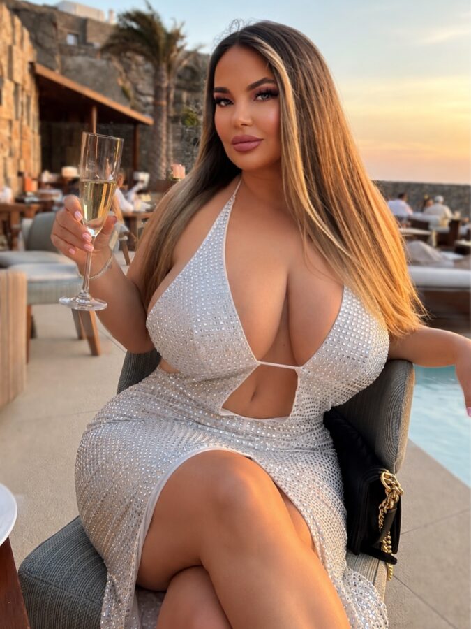 Glamour big breasted lady relaxing in bar
